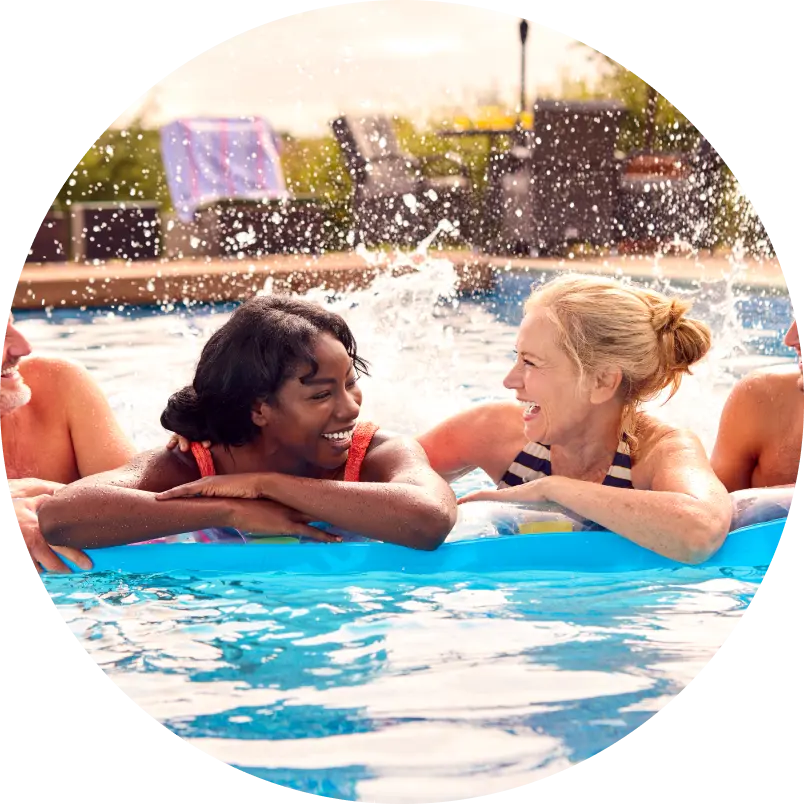 girls laughing while on the pool